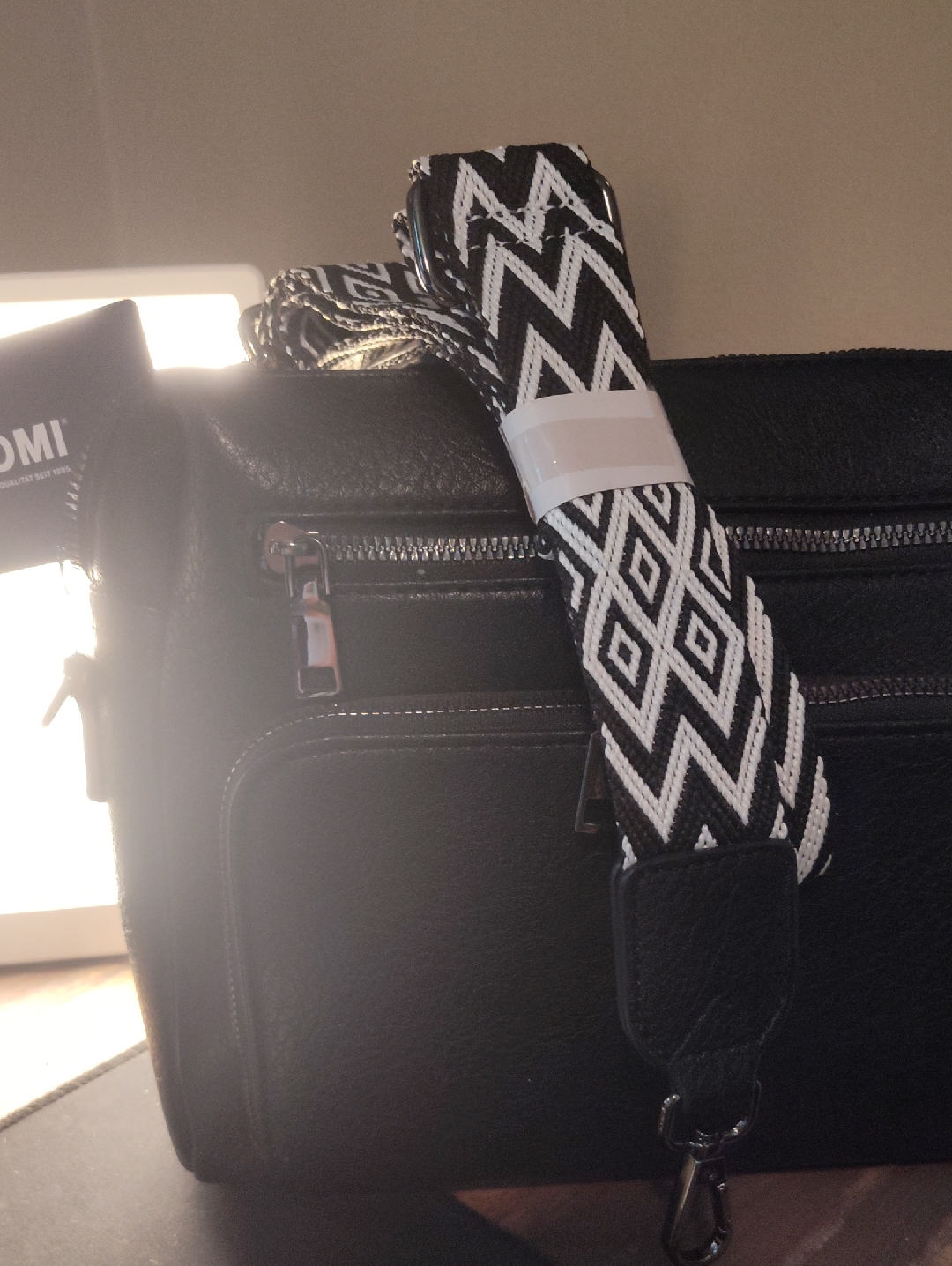 Tan . Tomi Black Crossbody Bag With Removable Black & White Geometric Strap